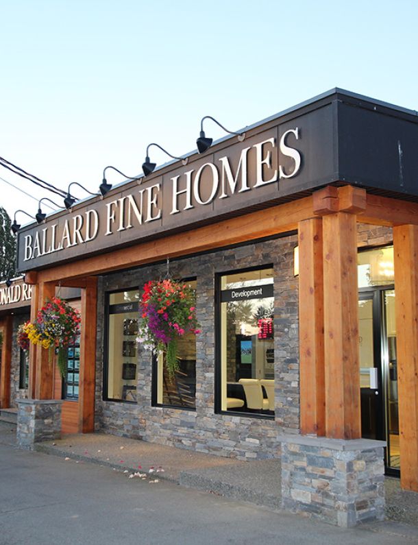 Photo of Ballard Fine Homes storefront with blue skies in the background